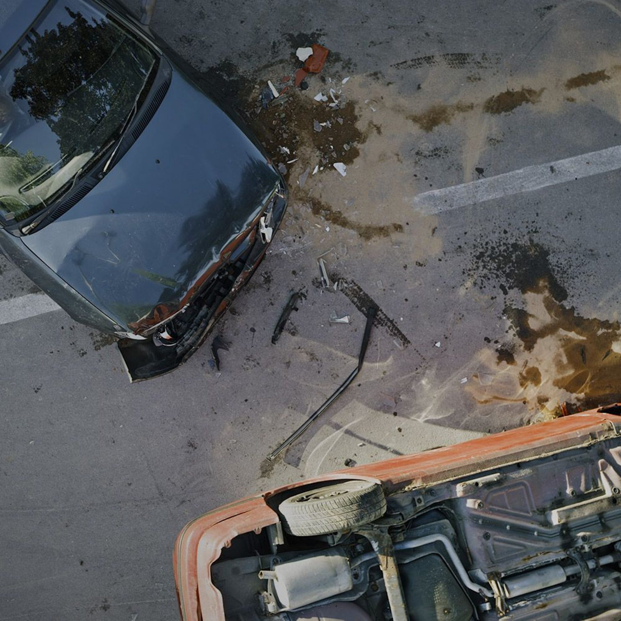 Aerial photo of two cars from a car wreck.